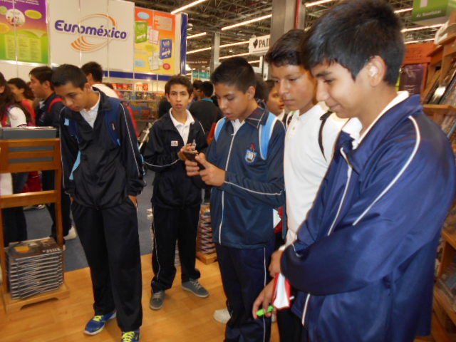 school boys captivated at the Arte Mexicano booth